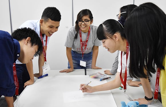 High school students doing group work in the summer college program.